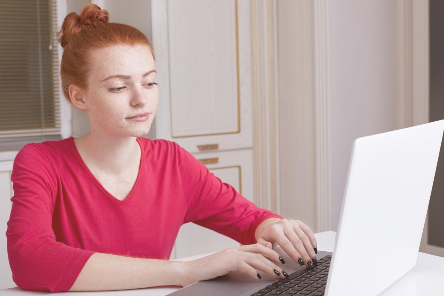 Modern office environment with team members working on testing documentation and analysis